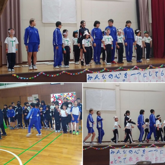 体育館で学年を越えた児童たちがお面をつけたり、歩いている複数の写真